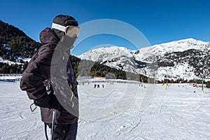 Skier next to the ski slopes, ready to go down the slope, Pyrenees, Grandvalira, Andorra.