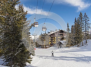 Skier on a piste in alpine ski resort