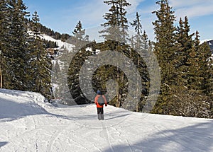 Skier on a piste in alpine ski resort