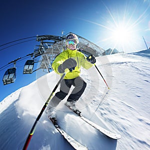 Skier on piste in high mountains