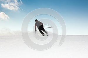 Skier on piste running