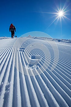 Skier is posing at camera at Gudauri resort in high mountaing of