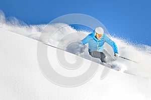 A skier in powder off-piste