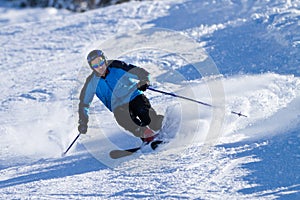 A skier in powder snow