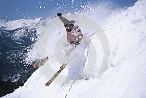 Skier Through Powdery Snow On Ski Slope