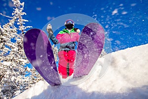 Skier is preparing for jump, lower angle of ski, blue sky winter forest