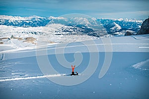 Skier resting in powder snow