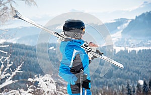 Skier resting on top of the mountain