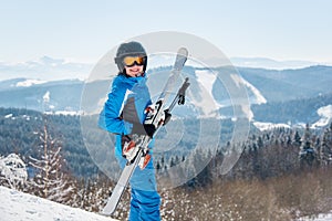 Skier resting on top of the mountain