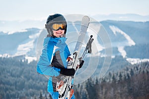 Skier resting on top of the mountain