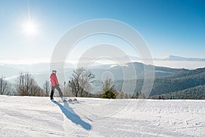 Skier resting on top of the mountain