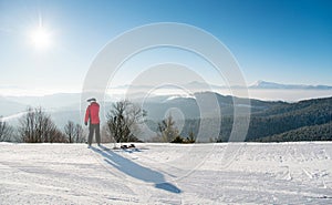 Skier resting on top of the mountain