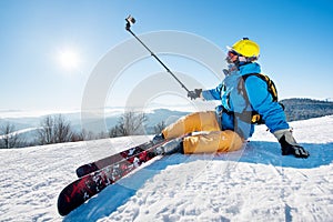 Skier resting on top of the mountain