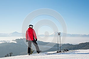 Skier resting on top of the mountain