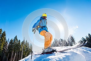 Skier riding in the mountains on a sunny winter day