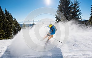 Skier riding in the mountains on a sunny winter day