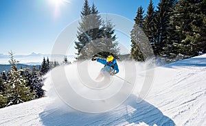 Skier riding in the mountains on a sunny winter day