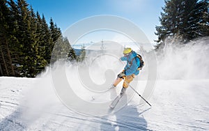 Skier riding in the mountains on a sunny winter day