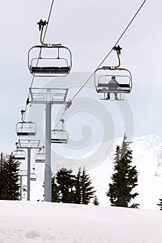 Skier Riding Ski Lifts Up Mount Hood