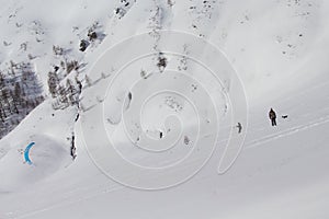 Skier riding snowkite at the mountain pass in Simplon, Switzerland