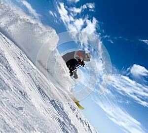 Skier rush in clouds of snow powder