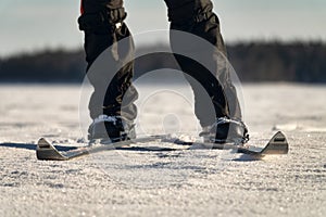 Skier`s legs and skis front position photo
