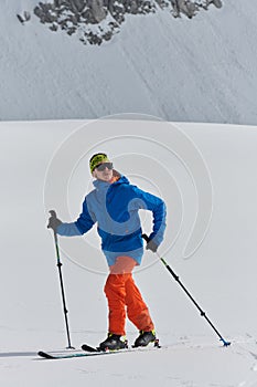 A Skier Scales a Treacherous Alpine Peak