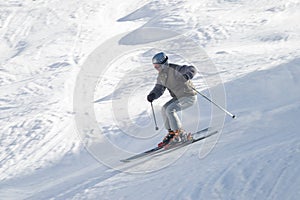 Skier with ski pole on snow