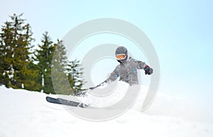 Skier skidding in the snow, off piste.