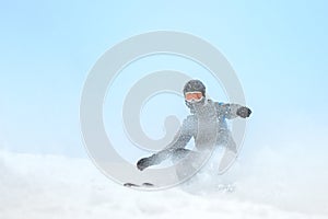Skier skidding in the snow, off piste.