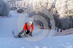 Skier skiing down the hill, winter day, Moscow region, Russia