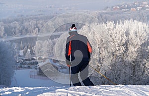 Skier skiing down the hill, winter day, Moscow region, Russia