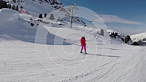 Skier Skiing Down On The Ski Slope In Winter Mountains On A Sunny Day