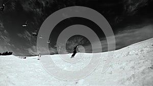 Skier skiing down on the slope. Black and white HD movie