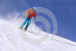 Skier skiing downhill