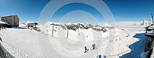 Skier skiing downhill in high mountains in Piz Gloria at Switzerland