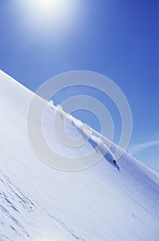Skier Skiing On Mountain Slope