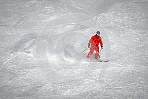 a skier sliding down a snow-covered slope alone