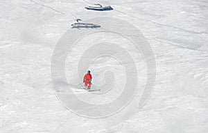 a skier sliding down a snow-covered slope alone