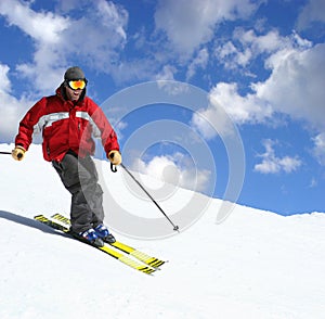 Skier on a slope photo