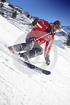 Skier on a slope photo