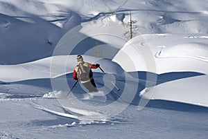 Skier on a slope in powder snow