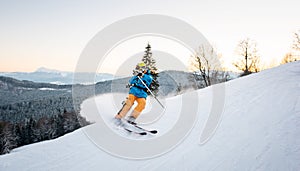 Skier in snow powder produces braking on slope of mountain