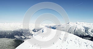 Skier standing on the top of snow capped mountain 4k