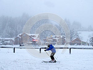 A skier in a strong storm in Bariloche