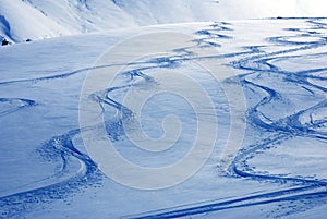 Skier tracks on snow dunes