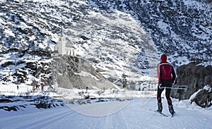 Skier and winter landscape in the italian alps