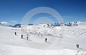 Skiers on Alpine ski slope