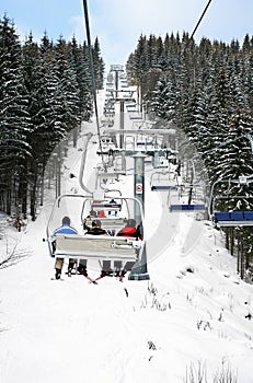 Skiers in chairlift