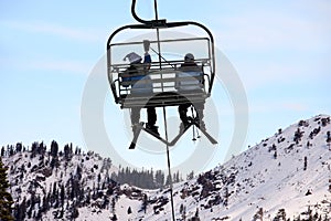 Skiers on chairlift